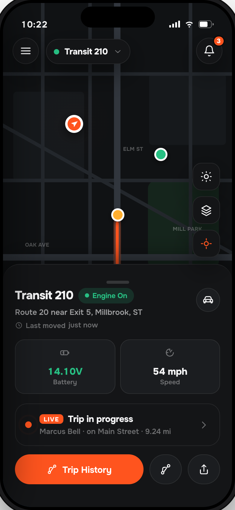 Moto Watchdog app tracking a vehicle live on the map, showing battery voltage, speed and a trip in progress